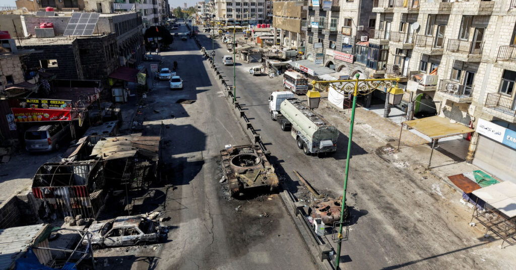 Syria, Israel agree to further talks on de-escalating conflict, Ekhbariya TV reports Destroyed tank and burnt vehicles on a deserted street in Sweida, Syria, showing aftermath of heavy clashes and urban conflict.