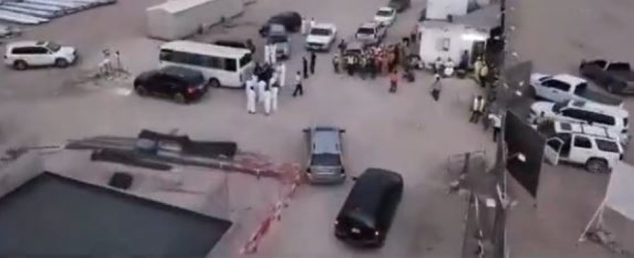 168 workers arrested in Mutlaa for violating labor, residence laws Aerial view of a Kuwait labor inspection site showing buses, cars, and workers being gathered by authorities during a raid.